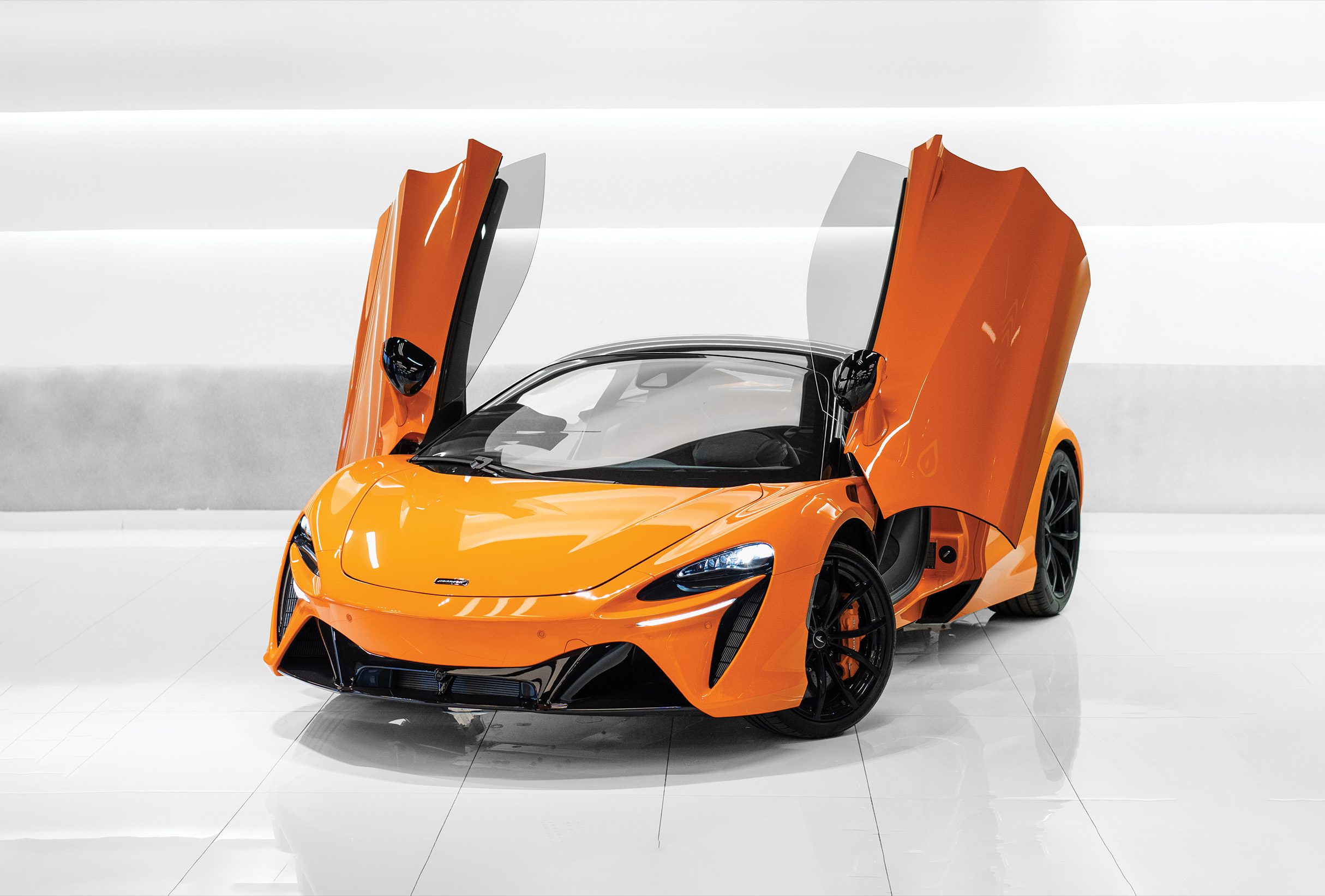Rent Mclaren Artura Orange in dubai 2 Home